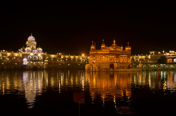 Golden Temple Amritsar Punjab Harmandir Sahib Gurdwara at Night View With Lights. Founded by Guru Nanak Dev, this is world's most holy sikh shrine, and one of the richest indian temples