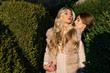 © Volodymyr - Fur salon. Girls walking by autumn city. Fashion models posing in eco fur coat. Stylish women in rich real fur coat in city street. Suite glamor fur salon beauty cosmetics make up beautiful hair.