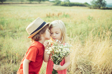 Love. Valentines day. Festive Art Greeting Card. Childhood on countryside. Lovely children. Human emotions - kids first love. Cute little children enjoying at countryside.