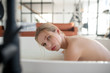 Beautiful tender woman feeling unbelievable relaxing in bath