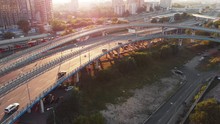 Beautiful Top Side View To The Cars Driving On Multi-level Highway On The Sunny Evening In Moscow. Picturesque Aerial Panorama Of The Road Traffic And Sunset City.