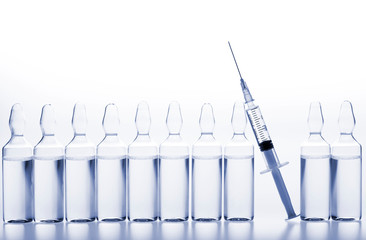 Wall Mural - Glass medicine ampoules and Syringe on white background