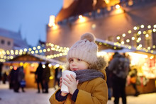 Little Boy Is Drinking Hot Chocolate Or Child Mulled Wine On Christmas Market In Tallinn, Estonia.