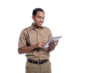 Wall Mural - happy indonesian government worker using tabletp pc. businessman using modern device. pegawai negeri sipil