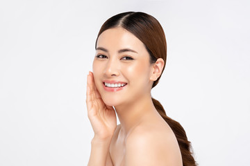 asian woman smiling with hand touching face for beauty and skin care concepts