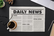 © DN6 - Business Newspaper and office supplies with notebook, hot coffee cup, glasses, books, newspaper and accessories on black desk topview with copy space, Daily Newspaper mockup concept