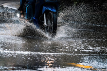 Motion Motorcycle  Rain Big Dirty Puddle Of Water Spray From The Wheels