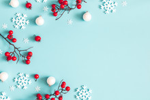 Christmas Or Winter Composition. Snowflakes And Red Berries On Blue Background. Christmas, Winter, New Year Concept. Flat Lay, Top View, Copy Space