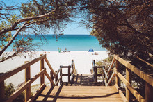 Beautiful View Of The Pristine Blue Water And White Sand Beach Down A Staircase In Dunsborough, Western Australia. 