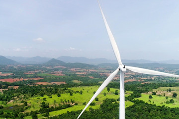 Wind turbine is alternative electrical power with blue sky, summer field, renewable energy