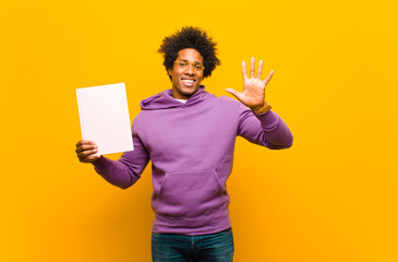 Wall Mural - young african american man  against orange background