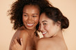 © puhhha - Beauty. Smiling women with perfect face skin and natural makeup portrait. Beautiful happy asian and african girl models with different types of skin on beige background. Spa skin care concept