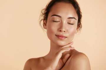 beauty face. woman with natural makeup and healthy skin portrait. beautiful asian girl model touchin