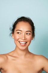 beauty face. smiling asian woman with perfect skin portrait. beautiful happy girl model with healthy