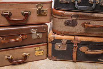 Wall Mural - Old, retro, suitcases lie on the table with white background