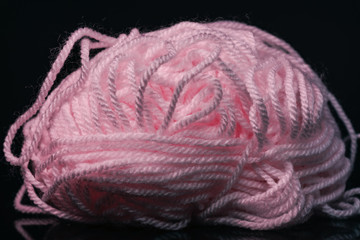 Poster - Beautiful pink tangle of thread on a dark  background texture.