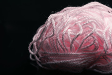 Poster - Beautiful pink tangle of thread on a dark  background texture.