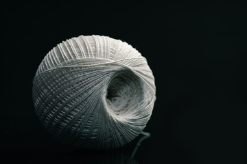 Poster - Beautiful white tangle of thread on a dark  background texture.