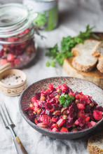 Russian Beetroot Salad Vinaigrette In A Bowl With Rye Bread, Rustic Background