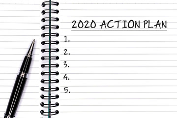Wall Mural - New Year concept - 2020 Action plan text on notepad with pen.