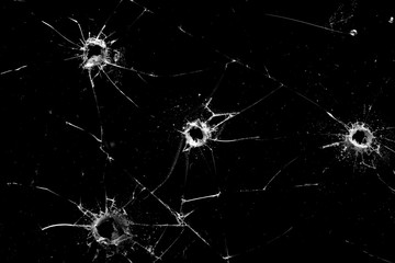 Poster - holes in the glass with cracks isolated on a black