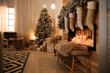 © New Africa - Stylish room interior with beautiful Christmas tree and decorative fireplace