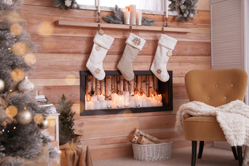 Wall Mural - Fireplace with Christmas stockings in room. Festive interior