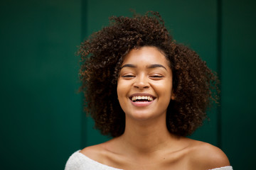 Wall Mural - close up front of young smiling african american woman with curly hair