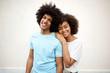 © mimagephotos - happy afro man and smiling african american woman against white background
