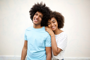 Wall Mural - happy afro man and smiling african american woman against white background
