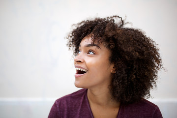 Wall Mural - horizontal portrait of happy young african american woman looking away