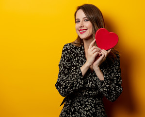 Sticker - Beautiful woman with heart shape box on yellow background