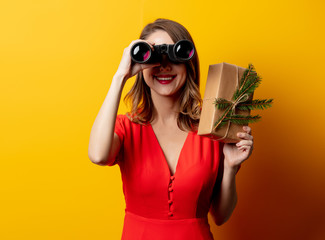 Sticker - Beautiful woman with gift box and binoculars