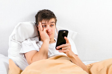 Canvas Print - Tired Young Man with a Phone