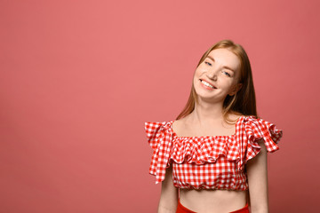 Wall Mural - Portrait of happy young woman on pink background, space for text