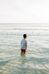 Wall Mural - Little Boy Boy Playing at the Beach