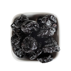 Wall Mural - prunes in a white bowl top view isolated on a white background