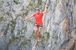 © zhukovvvlad - A man walks confidently along the highline.