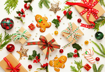 Wall Mural - christmas background with gingerbread cookies, gift boxes and branches of holly with red berries on 