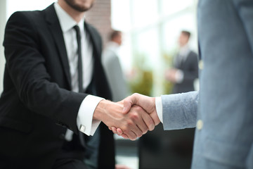 close up. business handshake on the background of the office.