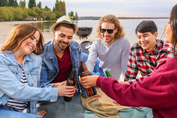 Sticker - Friends drinking beer at barbecue party near river