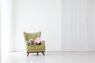 Wall Mural - green vintage chair in the interior of an empty white room