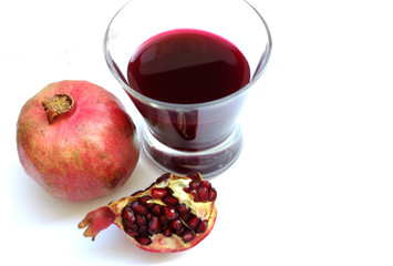 Poster - Glass of pomegranate juice and pomegranate fruit