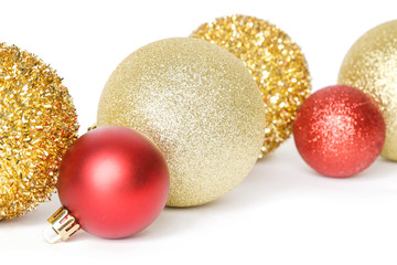 Gold and red Christmas shiny balls isolated on white background. Large glitter Christmas ornaments.