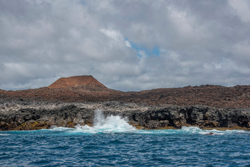 waves breaking on the coast of the island