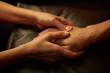 A woman does acupressure fingers for a man. hand massage with intimate lighting. Prelude before making love. Close. Complete relaxation