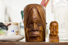 Thorpe, Washington / USA - August 12, 2018:  Unique Wood Carving Head Figures In An Antique Shop And Fruit Stand Outside Of Ellensburg, Washington.
