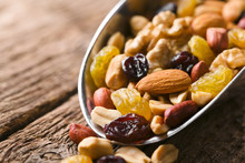 Healthy Trail Mix Snack Made Of Nuts (walnut, Almond, Peanut) And Dried Fruits (raisin, Sultana) On Iron Scoop (Selective Focus, Focus On The Front Of The Almond)