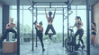 Five strong athletic woman during functional training in fitness club,