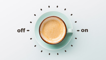 Blue cup with cappuccino over grey background